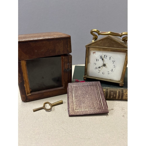 137 - A 19th Century French brass carriage clock with unusual triangular arched top complete with key and ... 