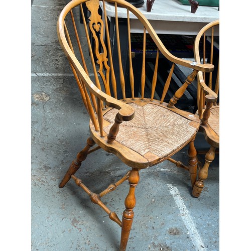 648 - Pair of Victorian Blonde Ash Windsor chairs, with hooped stick backs, central fret cut splats and ru... 