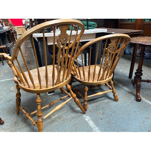 648 - Pair of Victorian Blonde Ash Windsor chairs, with hooped stick backs, central fret cut splats and ru... 