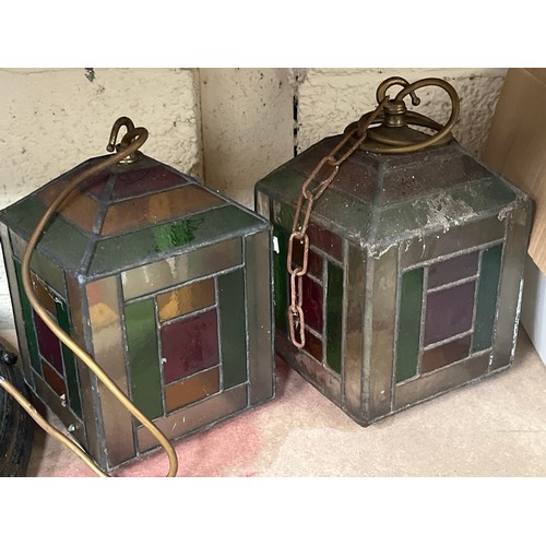 452 - Three early 20thC leaded glass pendant lamp shades, wired to electric with brass fittings and staine... 