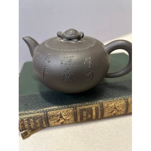 27C - A genuine Yixing teapot purple clay made by a pottery master and signed on base plus the Orpheus's t... 