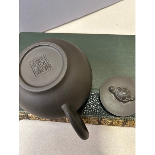 27C - A genuine Yixing teapot purple clay made by a pottery master and signed on base plus the Orpheus's t... 