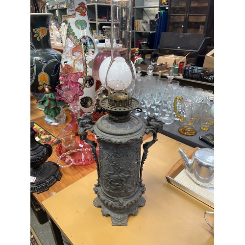 460 - Victorian Zimmermann & Co. Duplex oil lamp, with an unusual cast spelter body decorated with deep re... 