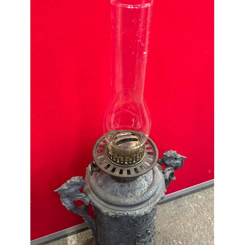 460 - Victorian Zimmermann & Co. Duplex oil lamp, with an unusual cast spelter body decorated with deep re... 