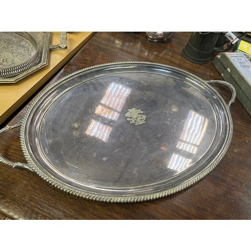 467 - Large oval 19thC silver plated serving tray, with a gadrooned  edge and handles, engraved with a sty... 