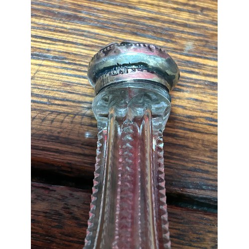 33A - An Edwardian cut glass scent bottle with sterling silver top, two inkwells and a mother of pearl she... 