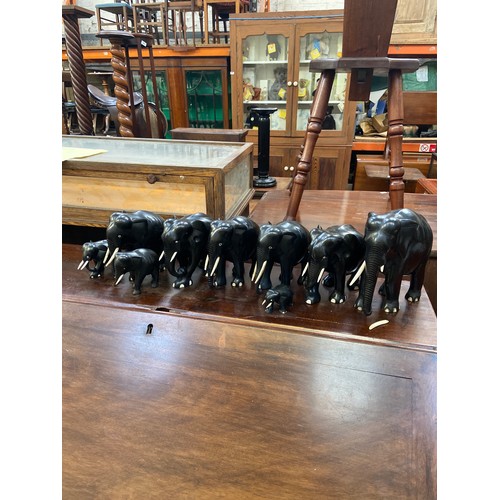 245 - A family of 9x carved ebony elephant sculptures.