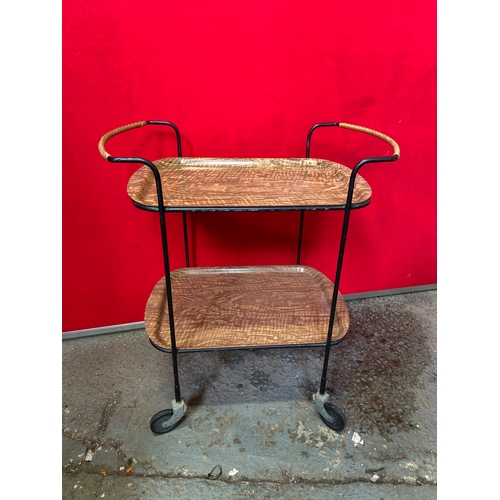 619C - Retro Formica hostess trolley, with two removable faux wood trays in a tubular metal frame. 74cm tal... 