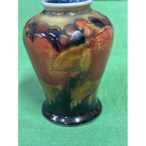 10 - An early 20th Century Moorcroft vase in the Pomegranate pattern with impressed marks “MOORCROFT ENGL... 
