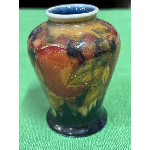 10 - An early 20th Century Moorcroft vase in the Pomegranate pattern with impressed marks “MOORCROFT ENGL... 