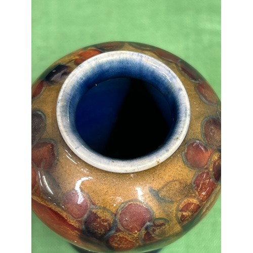 10 - An early 20th Century Moorcroft vase in the Pomegranate pattern with impressed marks “MOORCROFT ENGL... 