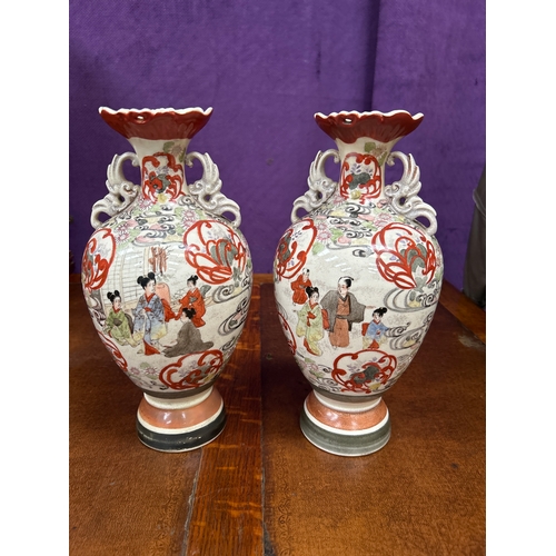 151 - Pair of early 20th Century Japanese Satsuma vases handpainted with figures in a garden. Restoration ... 