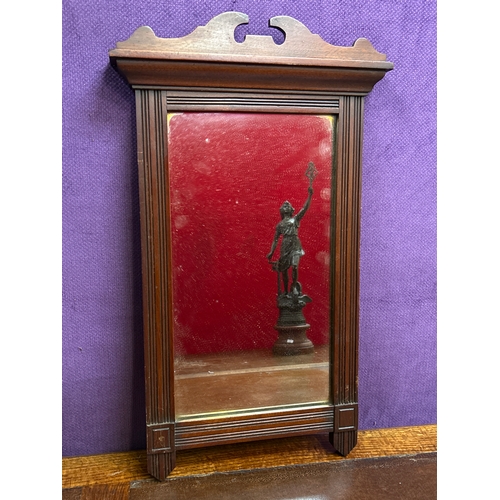 154 - An Edwardian mahogany framed wall mirror with pediment to the top 60cm h