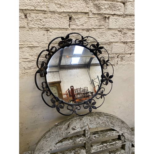 155 - Vintage round wall mirror, with decorative black wrought iron floral frame. 35cm diameter mirror, 46... 