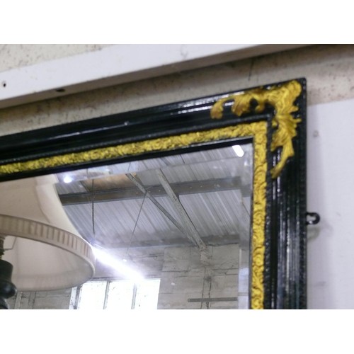 140 - Black and Gold Baroque style mirror with a bevel edge