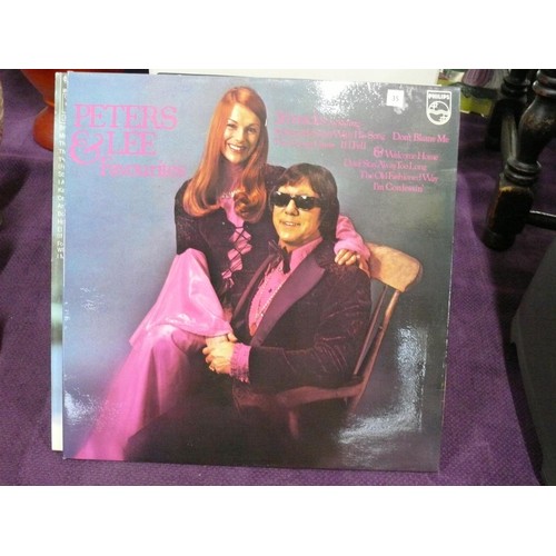 149 - White Vinyl Record box with LP's to include Peter's and Lee and a selection of singles