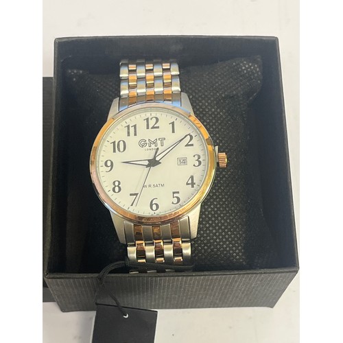 10B - A NEW G.M.T. GENTS WATCH PLUS DATE GOLD / STAINLESS STRAP STILL HAS TAG UNDER WINDER IN BOX working