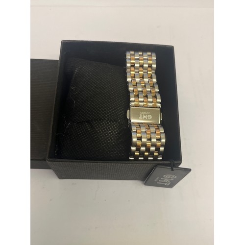 10B - A NEW G.M.T. GENTS WATCH PLUS DATE GOLD / STAINLESS STRAP STILL HAS TAG UNDER WINDER IN BOX working