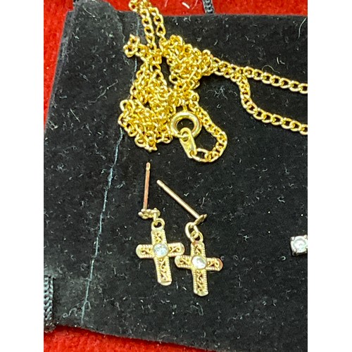 29 - A pair of 9ct gold cross earrings with white stones and also two cross pendants, one inlaid with mot... 