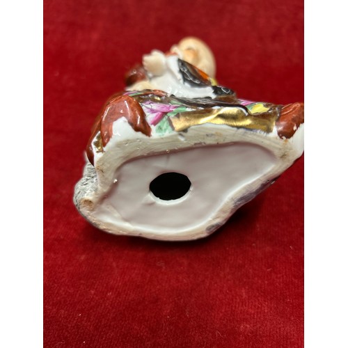 22 - Chinese porcelain figure of A deity “Shoulau” god of longevity, with a child on his shoulder