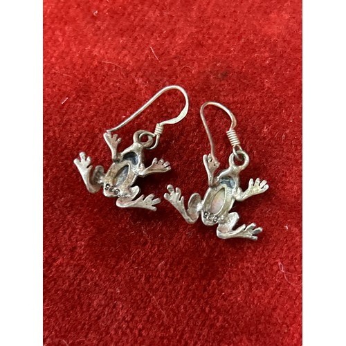 38 - Pair of sterling silver toad earrings with garnet eyes and inlaid with mother of pearl