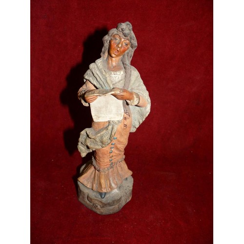 7 - Early 20thC continental pottery sculpture of a singing lady, probably Spanish. Approx 25cm tall. Und... 