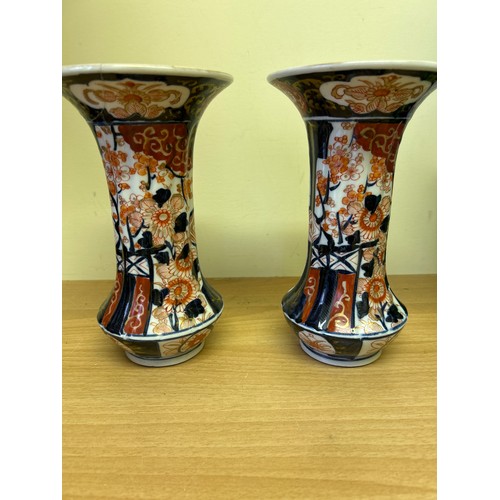 8 - Pair of 19th Century Japanese Imari vases, decorated with vases of flowers. One has repairs & cracks... 