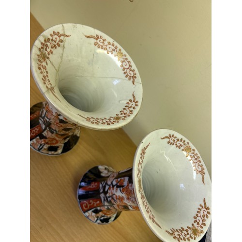 8 - Pair of 19th Century Japanese Imari vases, decorated with vases of flowers. One has repairs & cracks... 