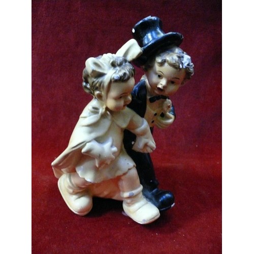 9 - Vintage chalkware figurine of a boy and girl dressed as a bride and groom, likely American early 20t... 