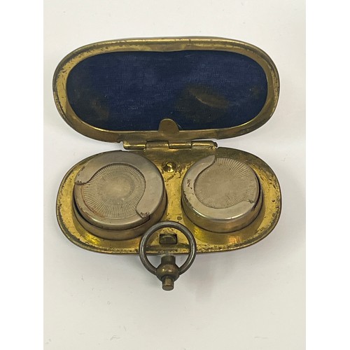 10 - Antique metal wares to include a brass and plated sovereign case, a trench art lighter a military so... 