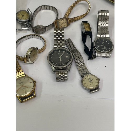 26 - Tin with contents of vintage watches. Includes an Art Deco chromium plated watch on black strap, Acc... 