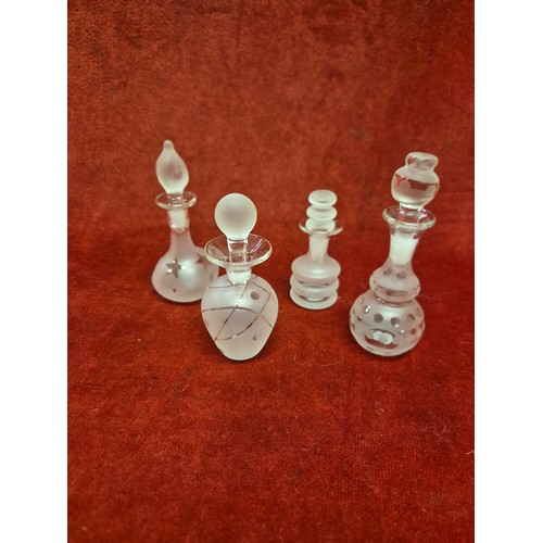 48B - Collection of 8 frosted glass scent bottles
