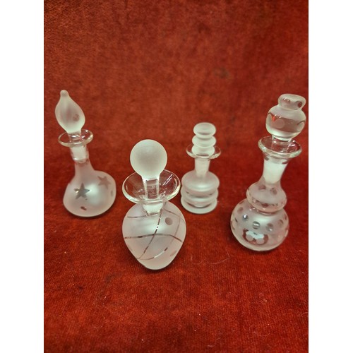 48B - Collection of 8 frosted glass scent bottles