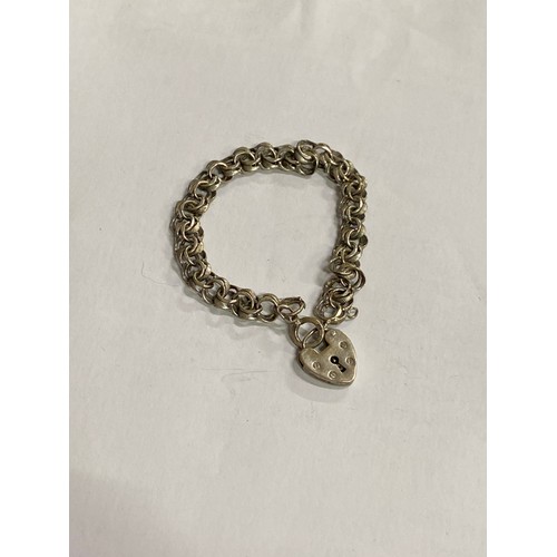 38 - A vintage Sterling Silver multi link bracelet with  heart padlock clasp- London hallmark 9.5 grams