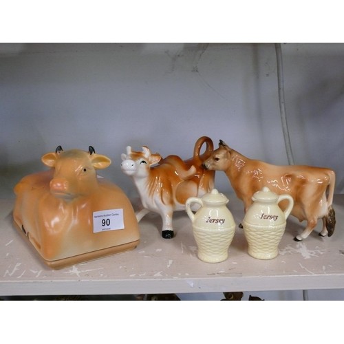 90 - Pair of ceramic cow creamers plus a cow butter dish and a Jersey cruet set