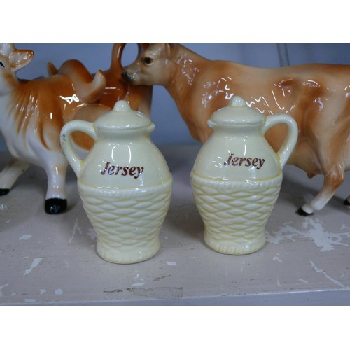 90 - Pair of ceramic cow creamers plus a cow butter dish and a Jersey cruet set