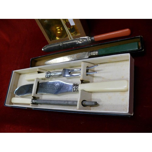 218 - Boxed carving and serving sets to include a carving knife with hallmarked silver collar and bakelite... 
