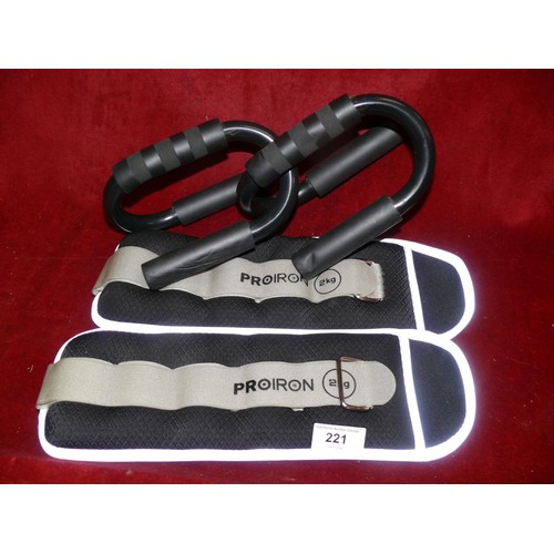 221 - A pair of push up bars and a pair of weighted straps