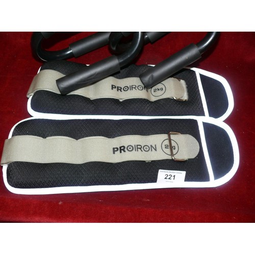 221 - A pair of push up bars and a pair of weighted straps