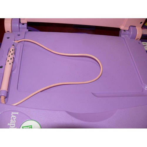 183 - Leapfrog LeapPad with books and cartridges plus a T Rex book and model