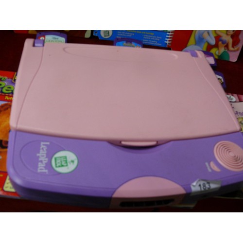 183 - Leapfrog LeapPad with books and cartridges plus a T Rex book and model