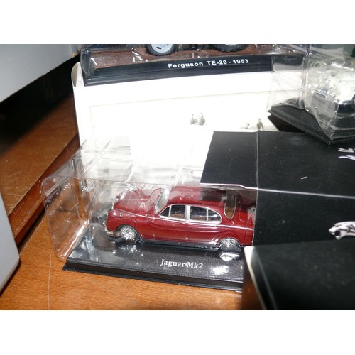 207 - 4 boxed vehicles 3 Jaguars plus a Ferguson tractor