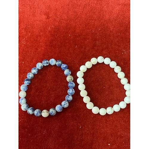 13 - Five natural stone beads including Red netstone, jasper and magnesite