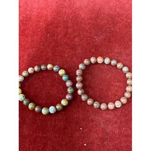 13 - Five natural stone beads including Red netstone, jasper and magnesite