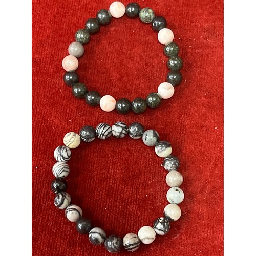 14 - Five natural stone bead bracelets including rose quartz, black silk, brown goldstone, magnesite