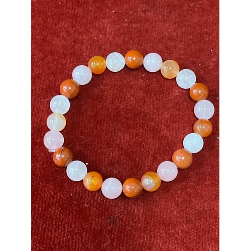 14 - Five natural stone bead bracelets including rose quartz, black silk, brown goldstone, magnesite