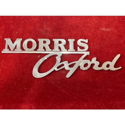 10 - Six vintage car badges etc including Wolseley, Riley , Morris, Cortina, Austin flying wing bonnet or... 