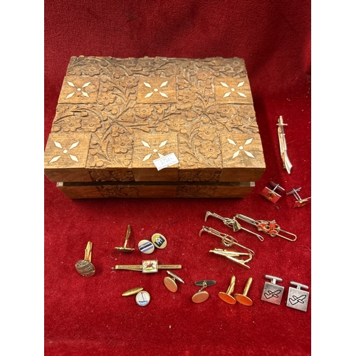 68 - Vintage Indian carved wood box full of cufflinks & tie pins. Includes equestrian themed tie clips,  ... 