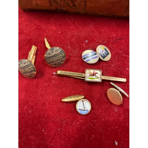 68 - Vintage Indian carved wood box full of cufflinks & tie pins. Includes equestrian themed tie clips,  ... 