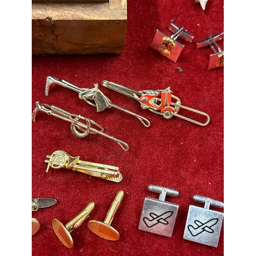 68 - Vintage Indian carved wood box full of cufflinks & tie pins. Includes equestrian themed tie clips,  ... 